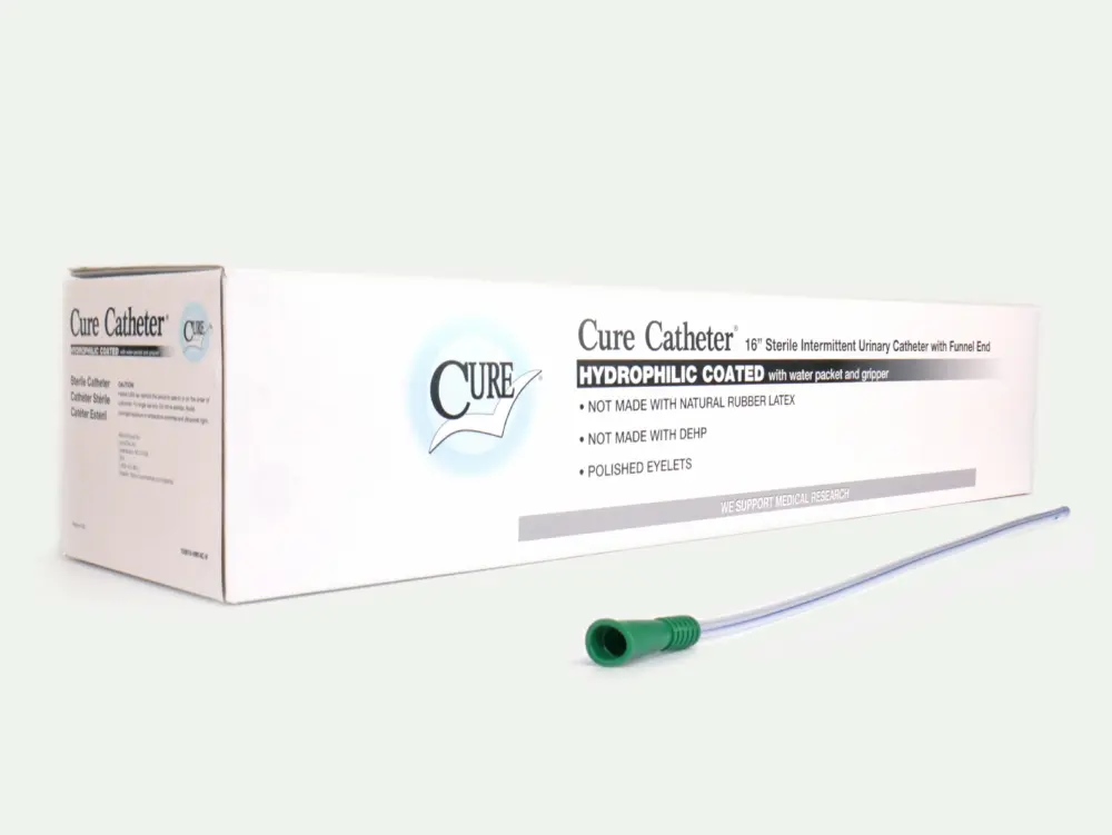 Picture of a box of 30 Cure Catheters from RA Fischer. Box reads "Cure Catheter - 16" Sterile Intermittent Urinary Catheter with Funnel End" "Hydrophilic coated with water packet and gripper" "Not made with natural rubber latex" "Not made with DEHP" "Polished Eyelets" "We support medical research". In front of the box is one of the catheters with a green gripper