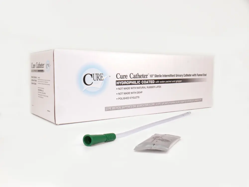 Picture of a box of Cure Catheters for urinary retention issues from RA Fischer. In front of the box is one of the catheters with a green gripper and a water packet next to it. Box reads "Cure Catheter - 10" sterile intermittent urinary catheter with funnel end." "Hydrophilic coated with water packet and gripper" "Not made with natural rubber latex" "not made with DEHP" "polished eyelets" "Cure Medical supports the search for a cure - 10% of net income is donated to medical research." Next to the box is on of the catheters with a green gripper and a waterpacket [ Personalized urology care ]