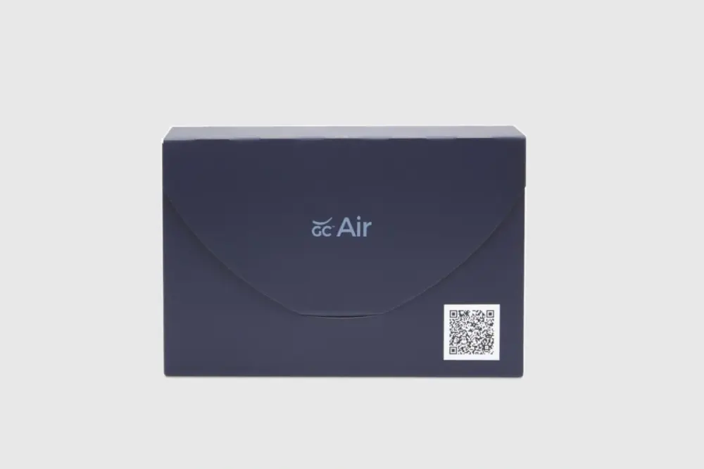 Image of the sleek blue box for GC Air. Box has the logo for the GC Air in the middle and a QR code on the bottom right