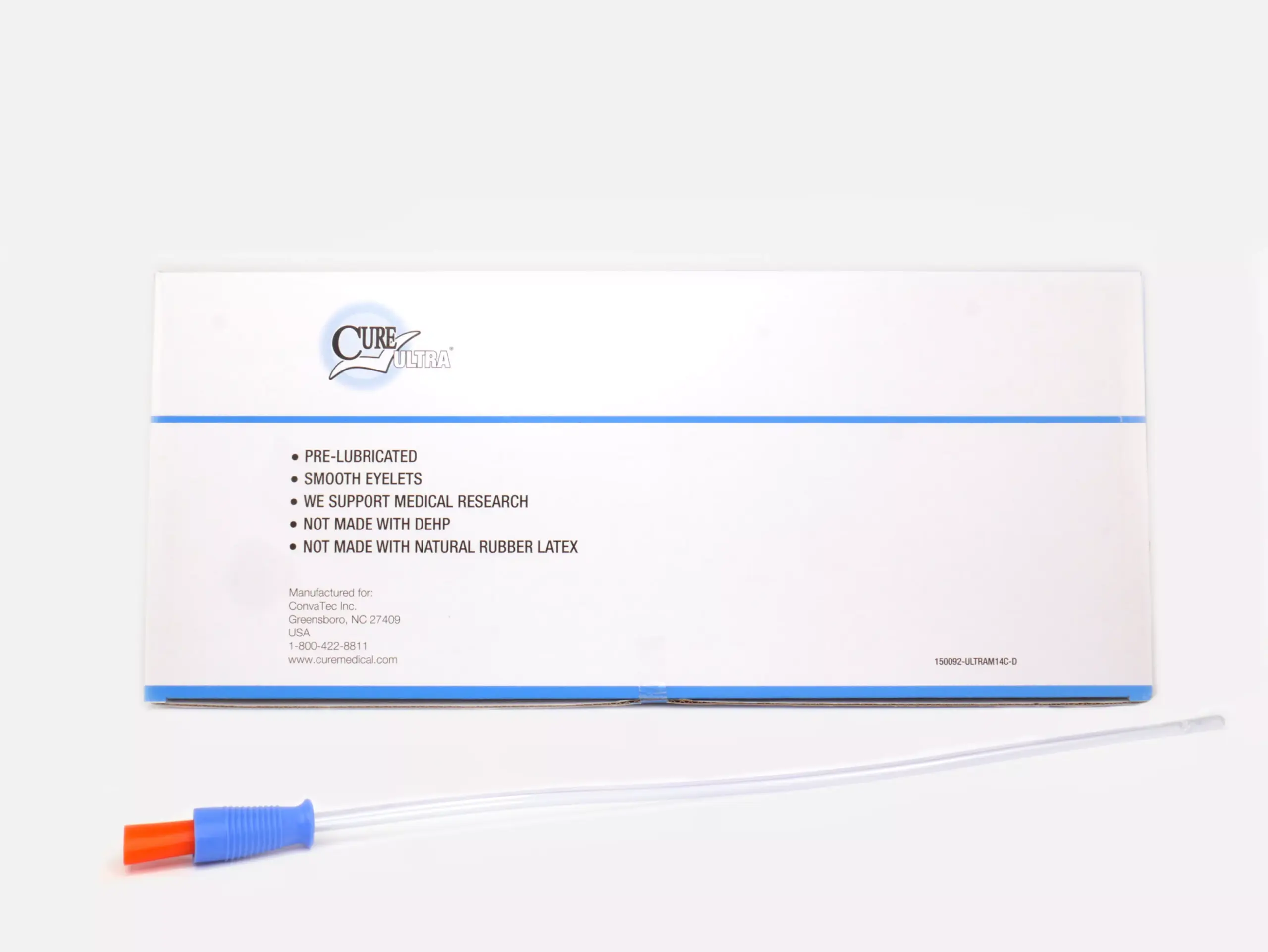 Image featuring a RA Fischer Co. Cure brand catheter box set against a white background. In front of the box is a catheter with blue and orange grip. The box is labeled 'Cure Ultra,' 'Pre-lubricated,' 'Smooth Eyelets,' 'We support medical research,' 'Not made with DEHP,' 'Not made with natural rubber latex.'
