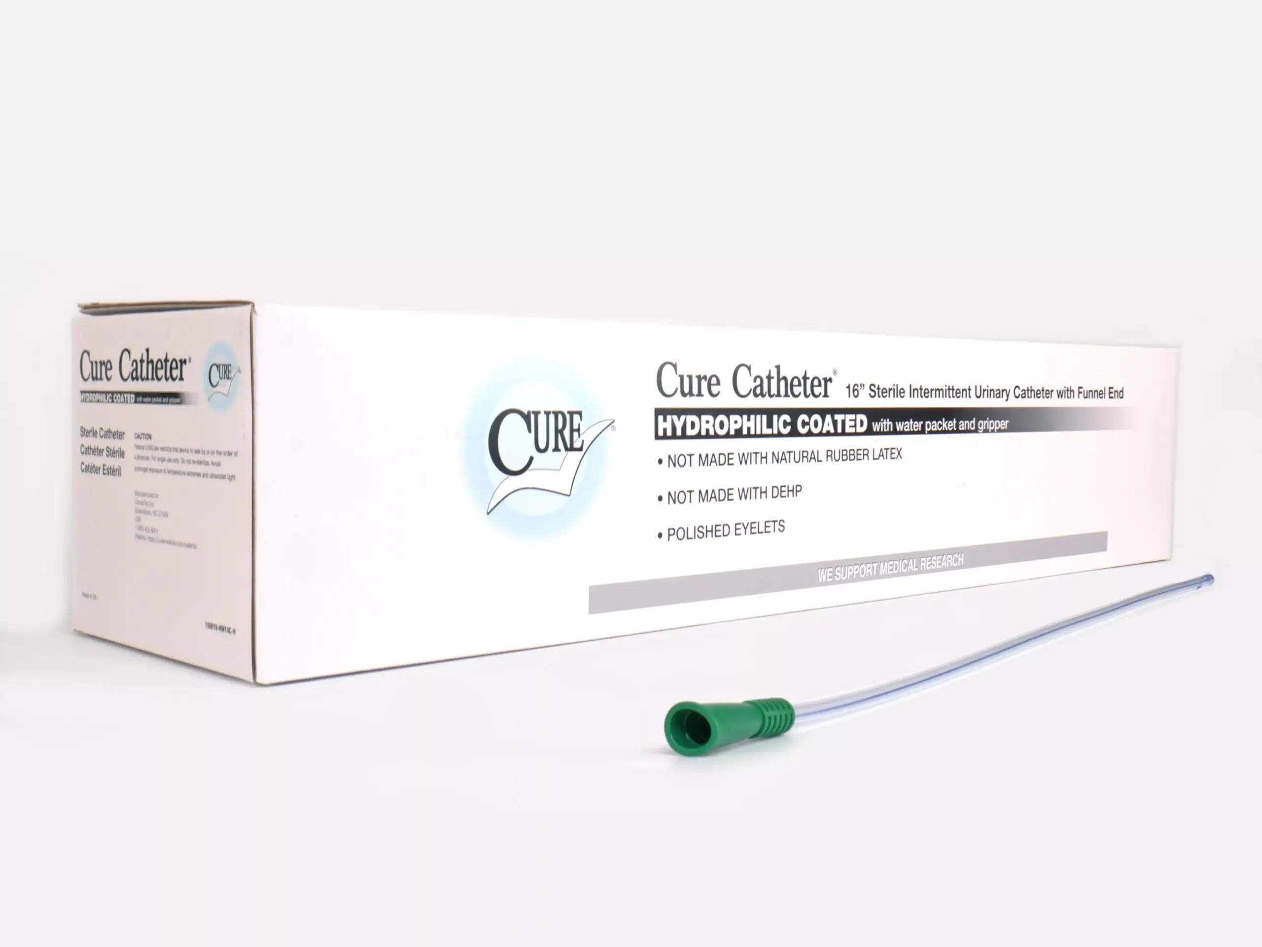 Image showing a RA Fischer Co. Cure brand catheter box on a white background. In the foreground, there is a catheter with a green grip. The box is labeled 'Cure Catheter. 16" Sterile Intermittent Urinary Catheter with Funnel End. Hydrophilic Coated with water packet and gripper. Not made with natural rubber latex. Not made with DEHP. Polished eyelets. We support medical research.'