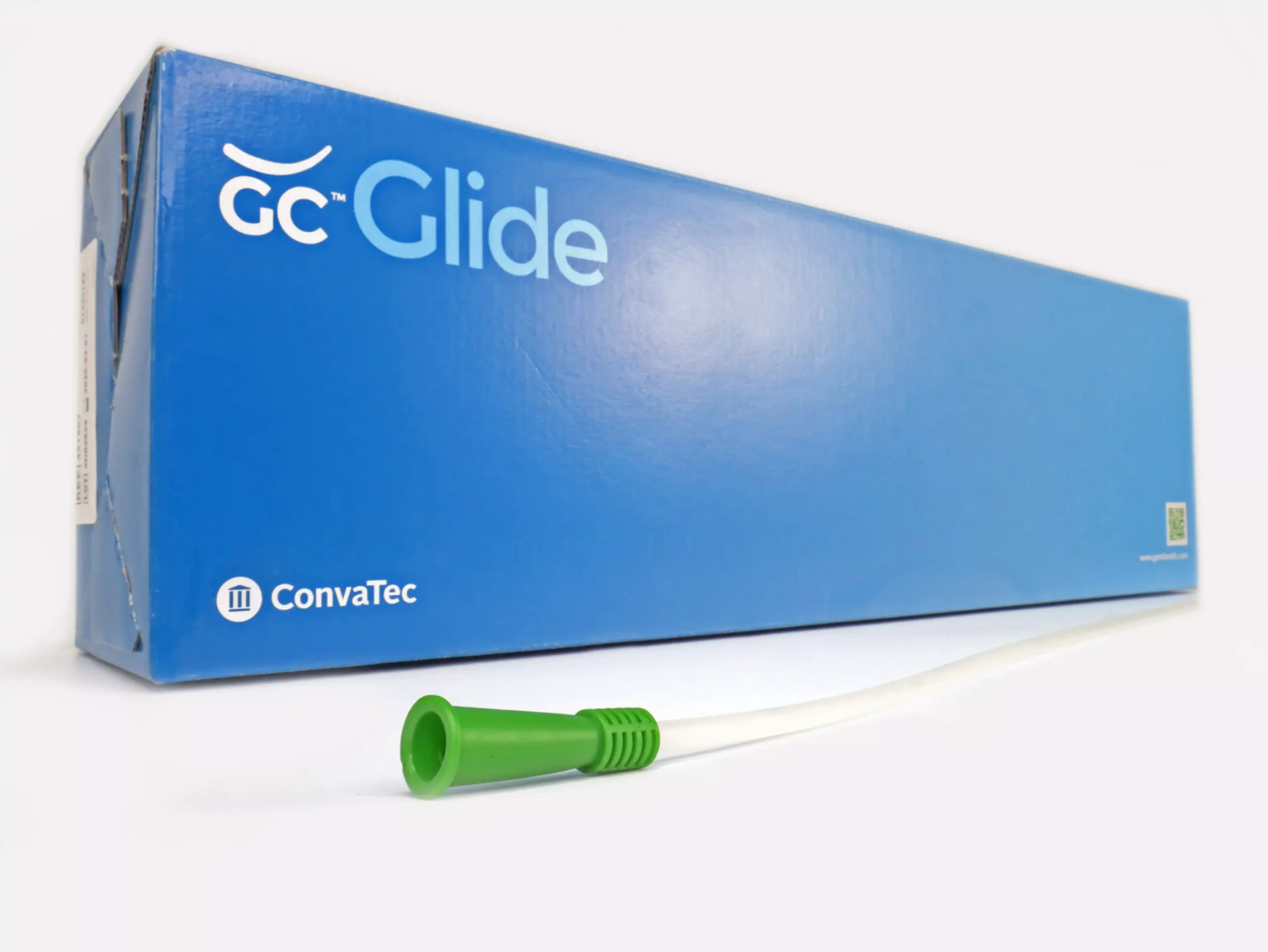 A visual against a white backdrop showcasing a box containing 30 GentleCath Glide catheters from RA Fischer. In front of the box is one of the catheters with a green gripper. The box clearly features "GC Glide," "Convatec," "www.gentlecath.com," and a QR code