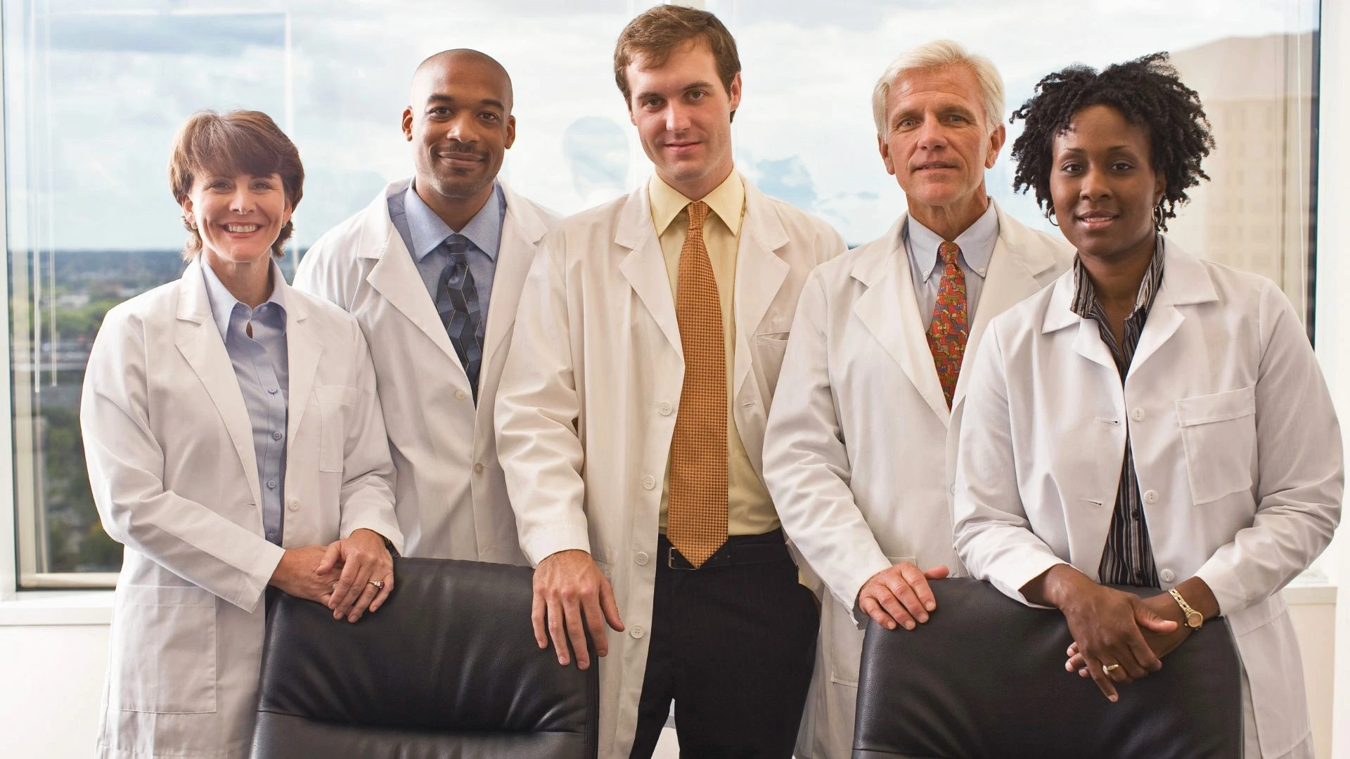 Picture of five medical professionals wearing white lab coats. [ Provider referral forms ]