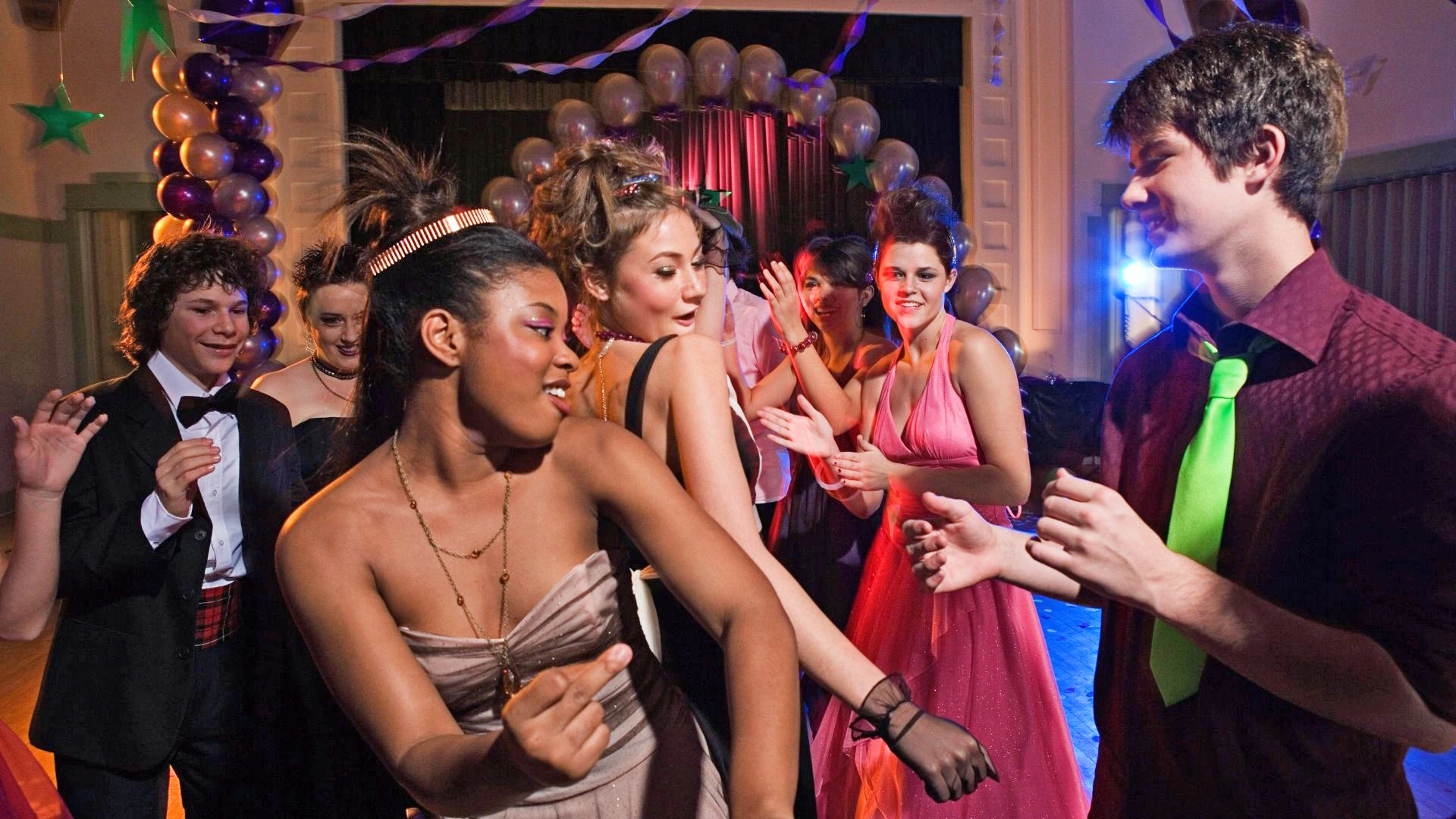 Picture of younger patients at prom type party dancing and enjoying themselves.