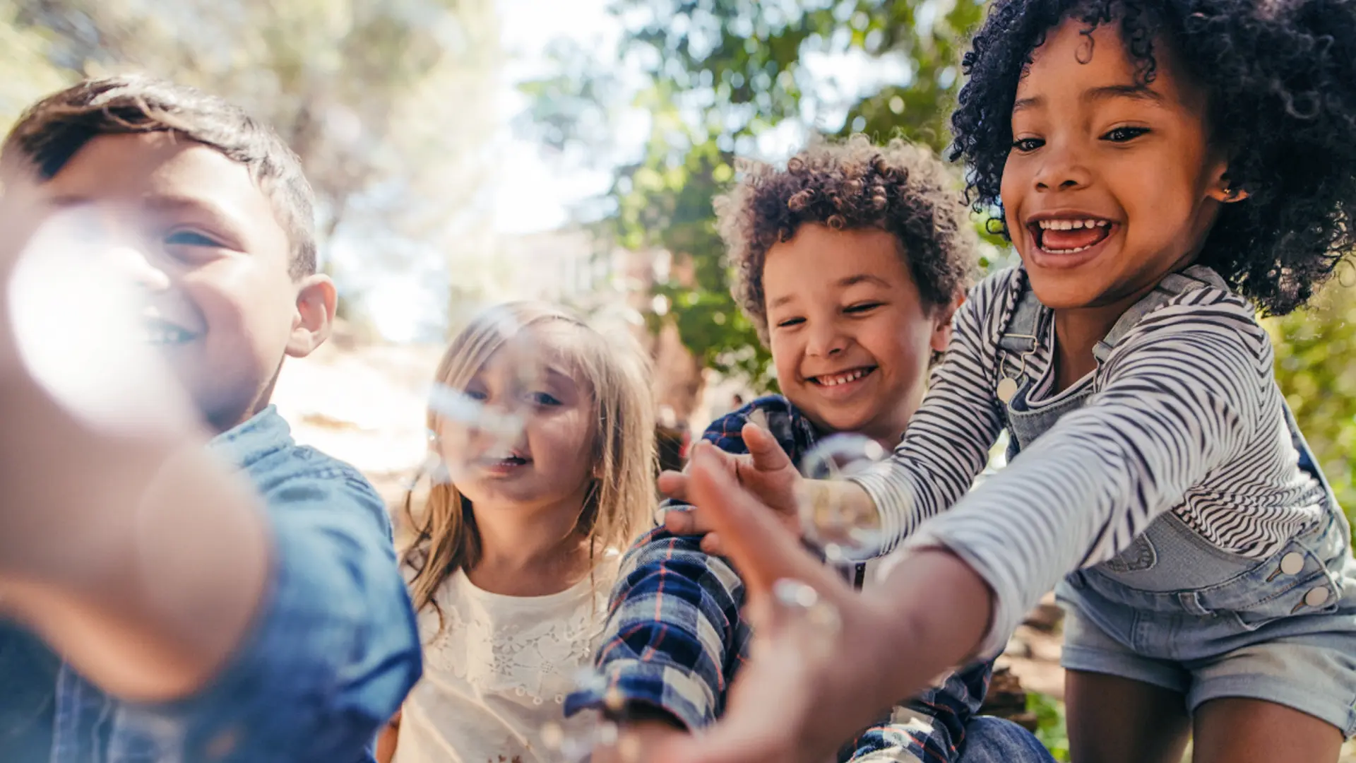 Group of Children playing in the park with bubbles [ RA fischer hyperhidrosis iontophoresis ]