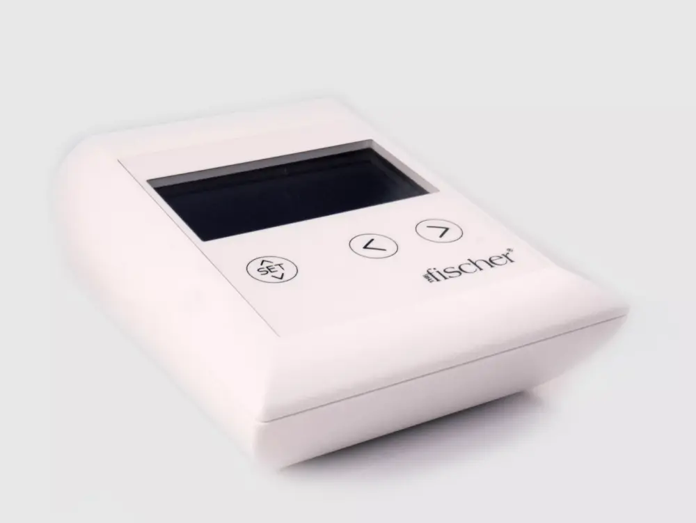 Photograph of RA Fischer's 'The Fischer' Device, showcasing the white, rectangular 'main control unit.' This specialized iontophoresis device is meticulously designed for the treatment of hyperhidrosis (excessive sweating). The device features a grey screen, with buttons labeled 'SET' and directional arrows. In the bottom right corner, there's the logo of the Fischer device. [ Iontophoresis Device for Sweating ]