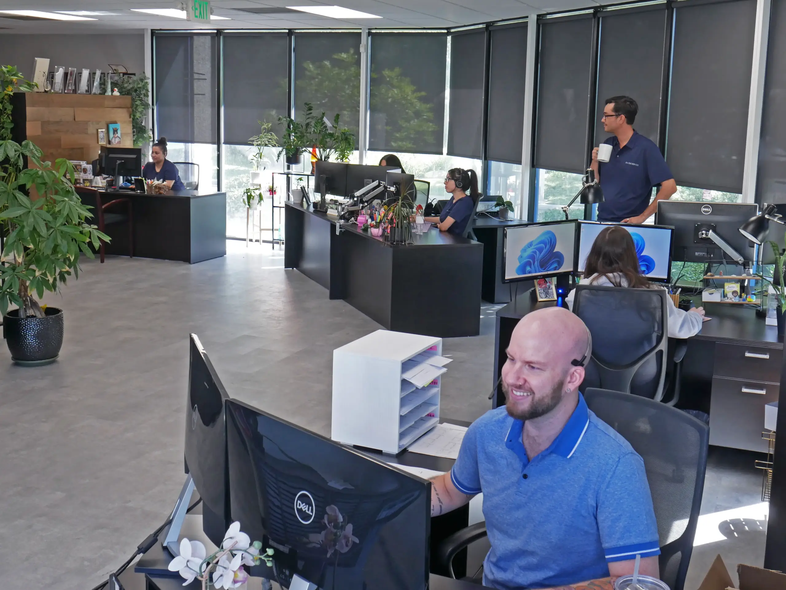 Picture of the RA Fischer office floor with happy employees.