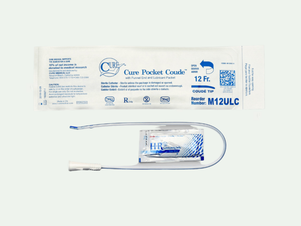 Photo of the Cure Pocket Coude catheter from RA Fischer (bottom) with a packet of H R Lubricating Jelly. The bag for the catheter is above and reads "Cure Pocket Coude TM with funnel end and lubricant packet"